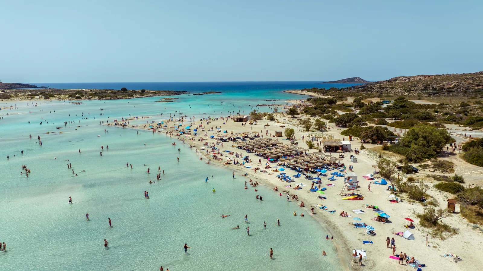 Elafonisi’s shallow lagoon and sandy beach on a sunny day