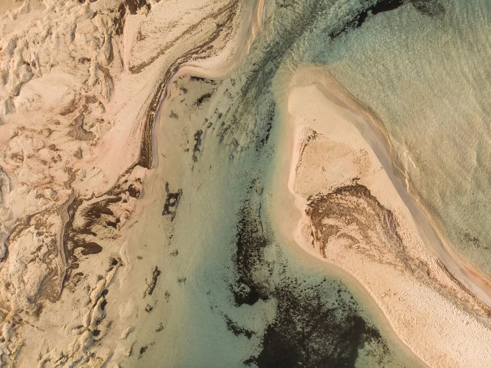An overhead view of Elafonisi’s sand formations and shallow water
